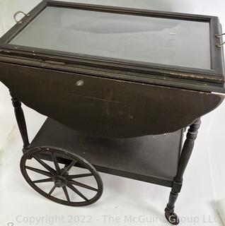 Wooden Tea Cart with 16 x 26" Glass Tray Top.  Sides flip up to create 36" Width.  