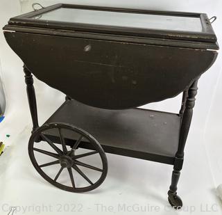 Wooden Tea Cart with 16 x 26" Glass Tray Top.  Sides flip up to create 36" Width.  