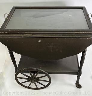 Wooden Tea Cart with 16 x 26" Glass Tray Top.  Sides flip up to create 36" Width.  