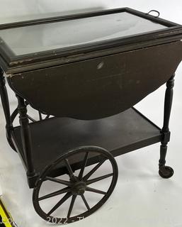 Wooden Tea Cart with 16 x 26" Glass Tray Top.  Sides flip up to create 36" Width.  