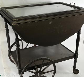 Wooden Tea Cart with 16 x 26" Glass Tray Top.  Sides flip up to create 36" Width.  