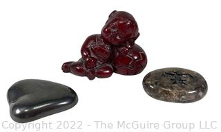 Asian Red Resin Sleeping Baby Buddha with Two Intaglio Agate Stones with Birds.  