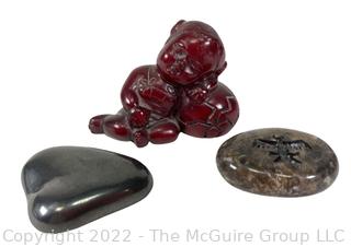 Asian Red Resin Sleeping Baby Buddha with Two Intaglio Agate Stones with Birds.  