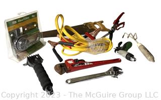 Selection of hand tools and set of jumper cables