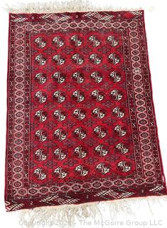 Middle Eastern Bokhara Wool Hand Woven Rug on Red Ground. Measures 45" x 67" 