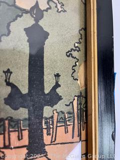 Framed Under Glass Wood Block Print of Paris Street Scene on Card Stock Signed by Artist.  Signature Illegible.  Chip in right edge.  10 1/2  23 1/2" 