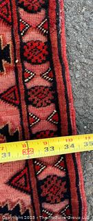 Wool Hand Woven in Pakistan Runner Rug on Red Ground. Measures 34" x 140" 