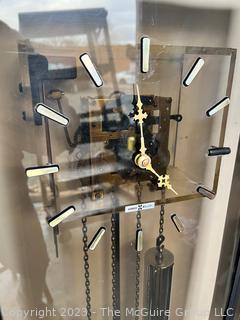 Post Modern Howard Miller Bronze Plexiglass and Chrome Weight Driven Floor Clock.  