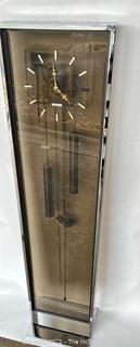 Post Modern Howard Miller Bronze Plexiglass and Chrome Weight Driven Floor Clock.  