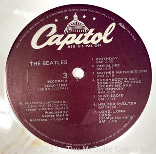 Vinyl Record Album: "The Beatles" White Album on White Vinyl Double Album with Four (4) Pictures of Band Members and Poster. Capitol Records 1978. Discoloration to both records SN# SEBX-4-11841