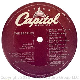 Vinyl Record Album: "The Beatles" White Album on White Vinyl Double Album with Four (4) Pictures of Band Members and Poster. Capitol Records 1978. Discoloration to both records SN# SEBX-4-11841