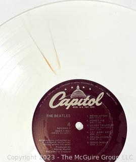 Vinyl Record Album: "The Beatles" White Album on White Vinyl Double Album with Four (4) Pictures of Band Members and Poster. Capitol Records 1978. Discoloration to both records SN# SEBX-4-11841