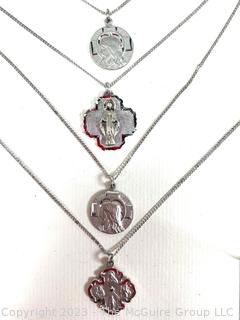 Four (4) Sterling Silver Religious Medals on Chains. 