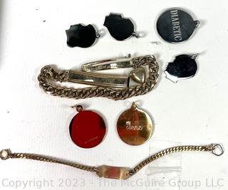 Group of Pendants and ID Bracelets