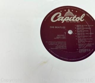 Vinyl Record Album: "The Beatles" White Album on White Vinyl Double Album with Four (4) Pictures of Band Members and Poster. Capitol Records 1978. Discoloration to both records SN# SEBX-4-11841