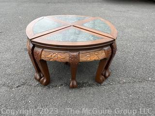 Asian Style Round Coffee Table with Carved Legs and Marble Inlaid Top.  Breaks into Four Pie Shaped Tables. 13" tall and 24" in diameter.