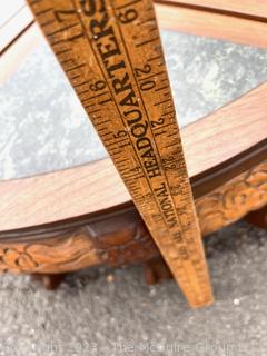 Asian Style Round Coffee Table with Carved Legs and Marble Inlaid Top.  Breaks into Four Pie Shaped Tables. 13" tall and 24" in diameter.