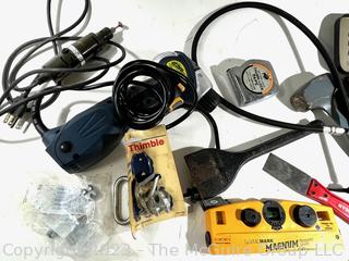 Eclectic Assortment of shop tools including Magnum Laser Level, Masonry Chisel, and 5 pound Metal Sledge 