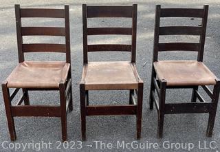 Set of Three (3) L&JG Stickley Ladderback Dining Chair with Leather Seats. Some repairs needed and some restoration has been done. Stickley Stamp found on two of three chairs.  