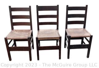 Set of Three (3) L&JG Stickley Ladderback Dining Chair with Leather Seats. Some repairs needed and some restoration has been done. Stickley Stamp found on two of three chairs.  