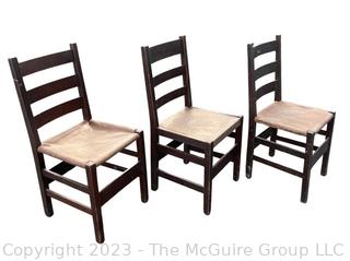 Set of Three (3) L&JG Stickley Ladderback Dining Chair with Leather Seats. Some repairs needed and some restoration has been done. Stickley Stamp found on two of three chairs.  