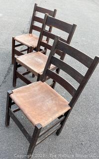 Set of Three (3) L&JG Stickley Ladderback Dining Chair with Leather Seats. Some repairs needed and some restoration has been done. Stickley Stamp found on two of three chairs.  