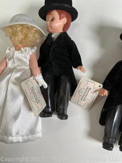 Collection of Vintage Cake Toppers in Hat Box.  Includes Madame Alexander Bride and Groom Dolls. 