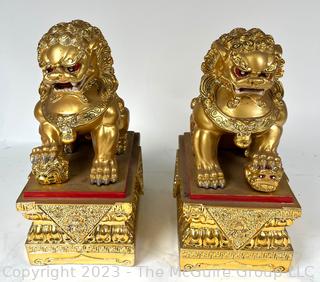 Set of Two (2) Chinese Guardian Lion Foo Dog Statues in Gilt Painted Resin. 