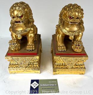 Set of Two (2) Chinese Guardian Lion Foo Dog Statues in Gilt Painted Resin. 