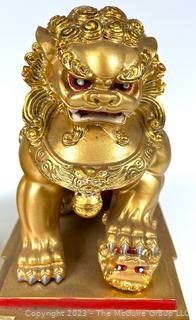 Set of Two (2) Chinese Guardian Lion Foo Dog Statues in Gilt Painted Resin. 