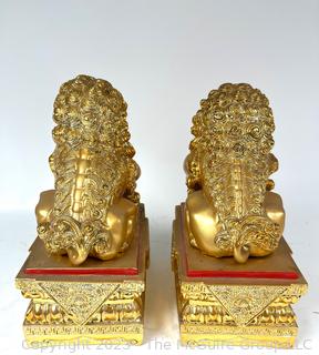 Set of Two (2) Chinese Guardian Lion Foo Dog Statues in Gilt Painted Resin. 