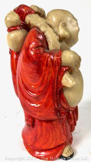 Resin Traveling Buddha Statue.  7" tall.