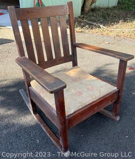 Mission Oak Arts and Crafts Stickley Brothers Furniture Rocking Chair with Brass Label.   One arm is loose.  26" wide x 30" tall.  