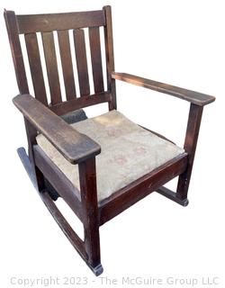 Mission Oak Arts and Crafts Stickley Brothers Furniture Rocking Chair with Brass Label.   One arm is loose.  26" wide x 30" tall.  