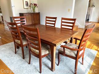 Stickley Mission Drawtop Dining Table with Two Self-Storing Leaves and Six (6) Arts and Crafts Style Dining Chairs. (one chair needs reglueing)  Table Expands from 72" to 114"L 42"W x 29"T (Note: leaves are darker than table)