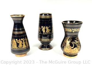 Three (3) Black, Made in Greece 24K Gold Decorated Vases.