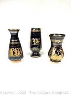 Three (3) Black, Made in Greece 24K Gold Decorated Vases.