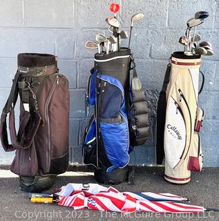 Two (2) Sets of Golf Clubs (Men's & Women's) with Umbrellas and (3) Golf Bags