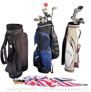 Two (2) Sets of Golf Clubs (Men's & Women's) with Umbrellas and (3) Golf Bags