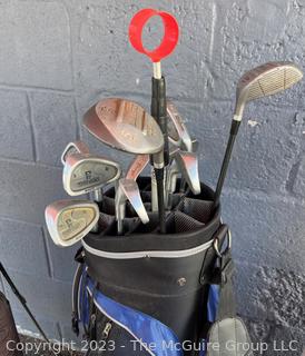 Two (2) Sets of Golf Clubs (Men's & Women's) with Umbrellas and (3) Golf Bags