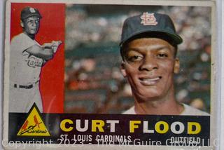 Baseball Cards of Lou Brock & Curt Flood, individual of Curt Flood, and Chipper Jones.