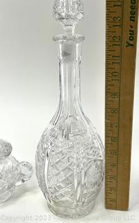 Two (2) Pieces of Cut Clear Crystal Glass Including Decanter and Jar with Lid. 