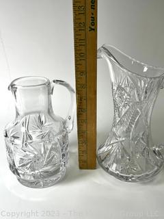 Two (2)  Cut Clear Crystal Glass Pitchers. 