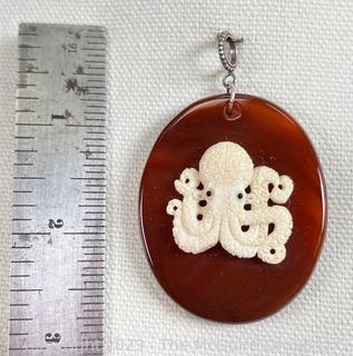 Vintage Carved Bone Octopus Charm Mounted on Cornelian Pendant with Sterling Silver Bale. 