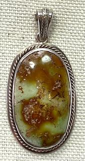 Polish Agate Stone Pendant in Sterling Silver Surround. 