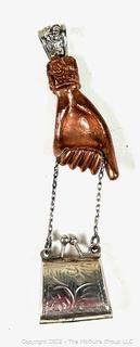 Copper Hand Holding Sterling Silver Locket Purse Pendant.