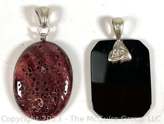 Two (2) Pendants Made of Black Onyx and Polished Spring Oyster Shell with Sterling Fittings