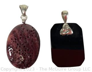 Two (2) Pendants Made of Black Onyx and Polished Spring Oyster Shell with Sterling Fittings