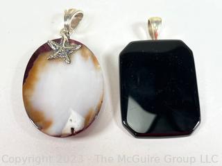 Two (2) Pendants Made of Black Onyx and Polished Spring Oyster Shell with Sterling Fittings