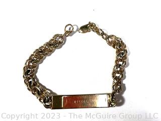 Men's 14kt Yellow Gold ID Bracelet with Inscriptions on Front and Back.  Link broken.  25.5 grams